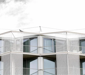 طراحی سه‌بعدی نمای ساختمان مدرن با شبیه‌سازی دقیق حجم، نور و متریال توسط گروه نماسازان پارس